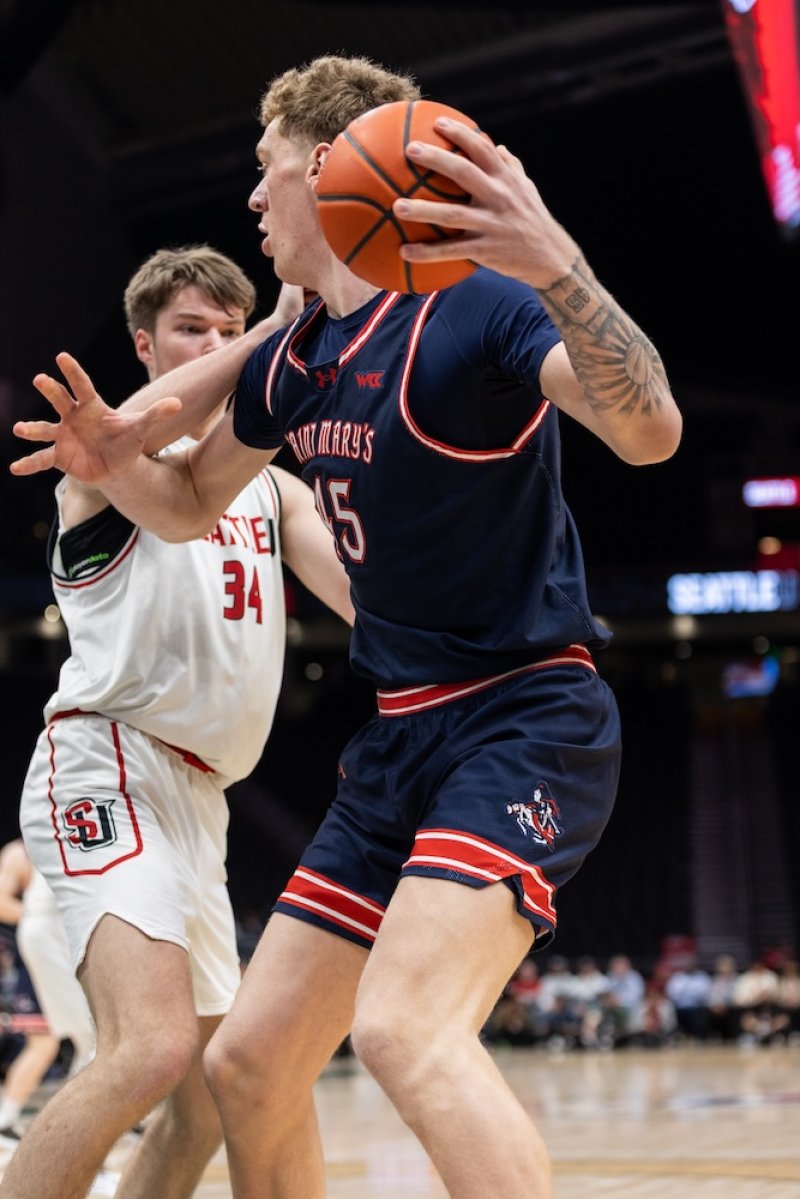 Basketball player Andrew McKeever readies to shoot against Seattle in February 2026