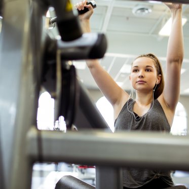 Student using weight machine
