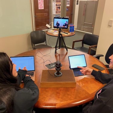 two women working on their laptops