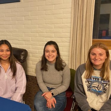 picture of 3 people sitting