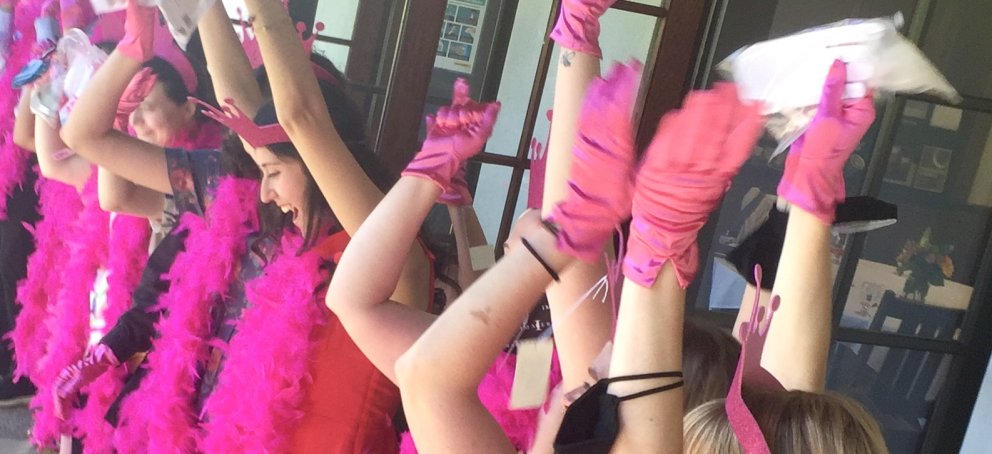women wearing pink gloves