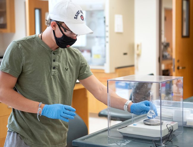 student works on science experiment
