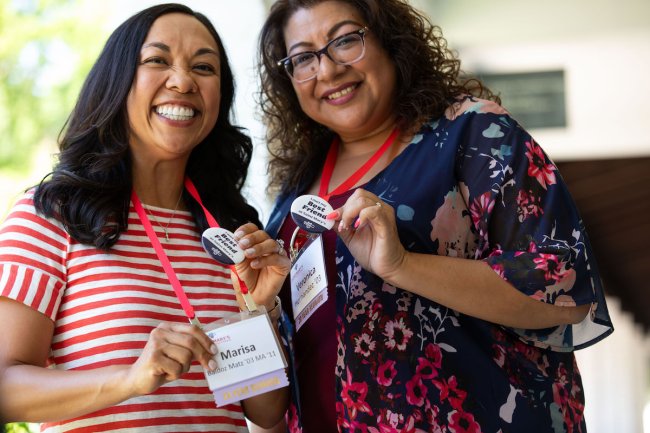 Marisa Soto Baldoz and Veronica Hernandez, class of 2003, show their "best friend" buttons at Reunion 2023