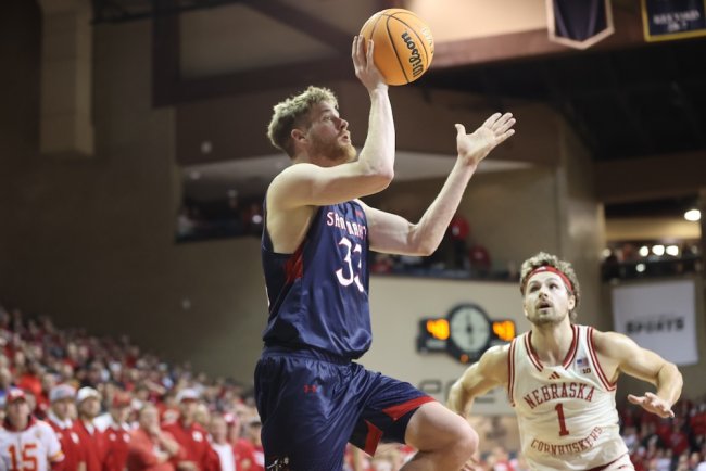 Men's Basketball player Luke Barrett shoots against Nebraska on Nov. 17, 2024