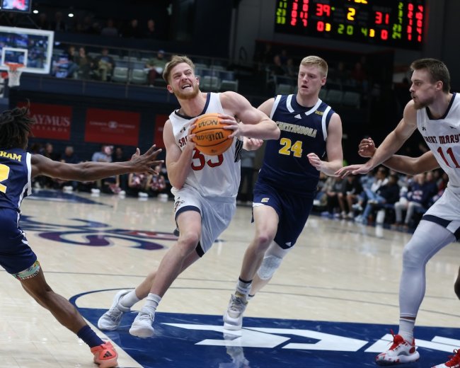 Men's Basketball player Luke Barrett drives against Chattanooga in November 2024