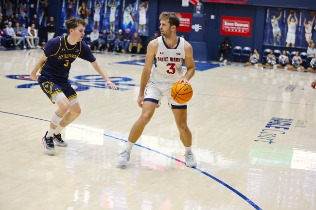 Augustas Marciulionis goes up against a Merrimack player