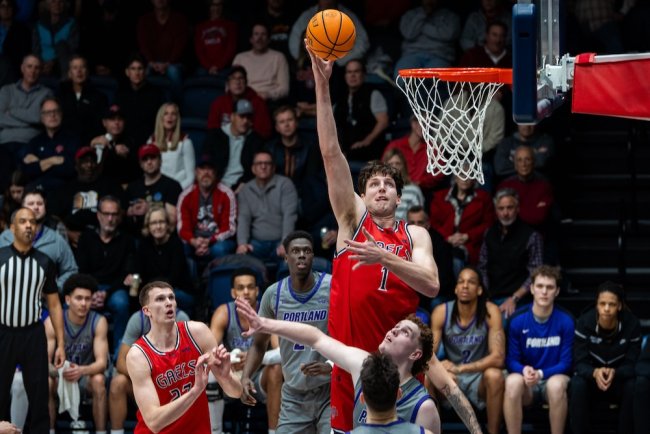 Men's basketball player Harry Wessels shoots against Portland in February 2025