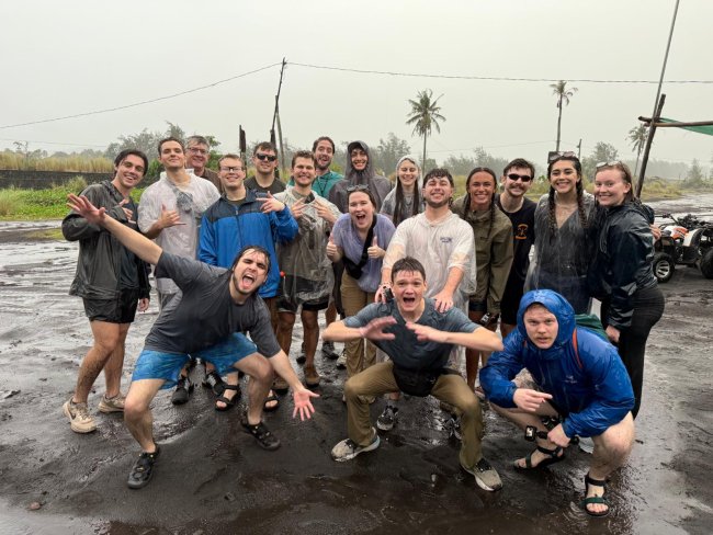 Students in the rain in the Philippines
