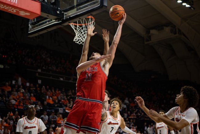 Men's basketball player Mitchell Saxen shoots against OSU in February 2025