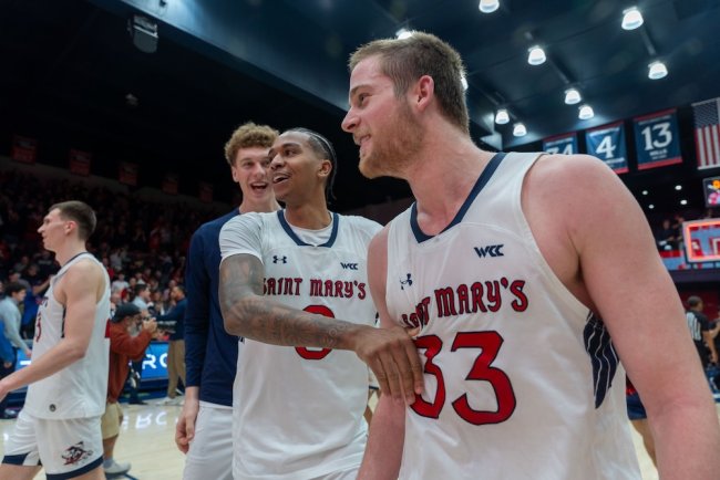 Men's basketball players Mikey Lewis and Luke Barrett celebrate beating Gonzaga in February 2025
