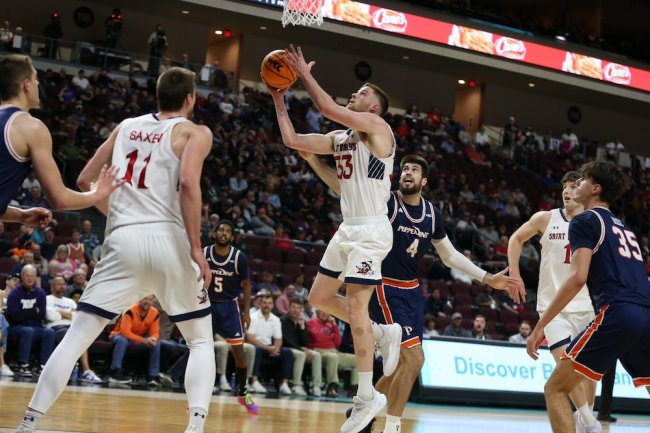 Men's basketball player Luke Barrett shoots against Pepperdine in 2025 WCC Semifinals