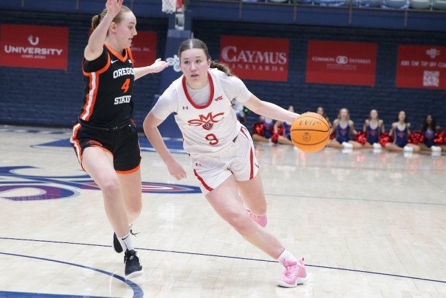 Women's basketball player Maya Jones drives against OSU in February 2025