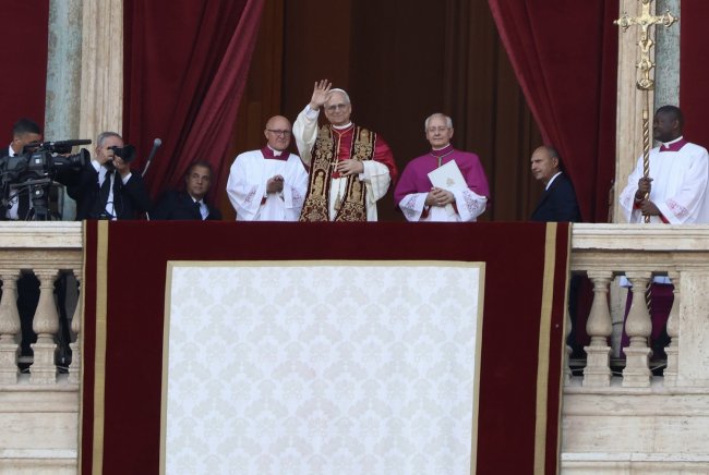Pople Leo XIV waving from St. Peter's balcony in May 2025
