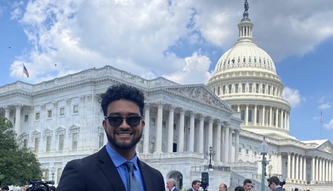 Dom Fleming '25 posing by US Capitol building