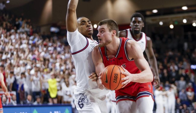 Mitchell Saxen drives the ball down the court against Gonzaga
