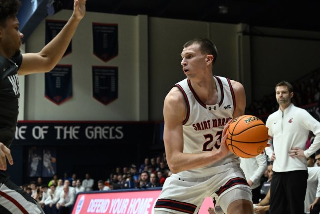 Basketball player Paulius Murauskas holds the ball while the Gaels play WSU in January 2026