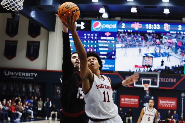 Basketball player Dillan Shaw shoots against Seattle in January 2026