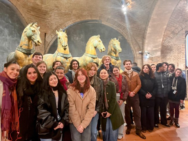Students posing at a historical site for Decadence in Venice class