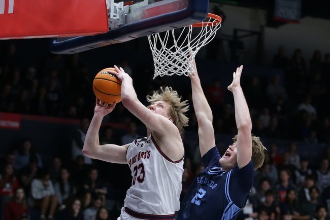 Basketball player Liam Campbell shoots against San Diego in February 2026