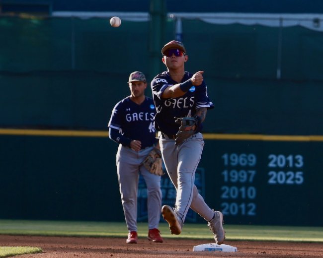 Baseball player Cody Kashimoto throws the ball for a double play against Cal Poly in 2026 NCAA Regional