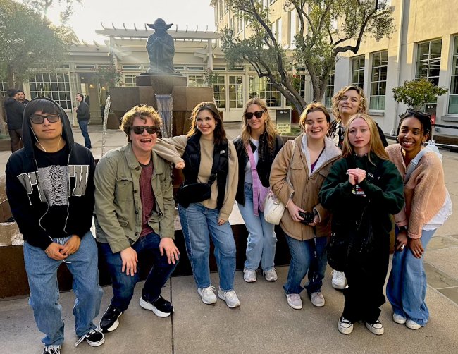 Eight Saint Mary's students in front of a statue of Yoda at SF Film Festival 2026