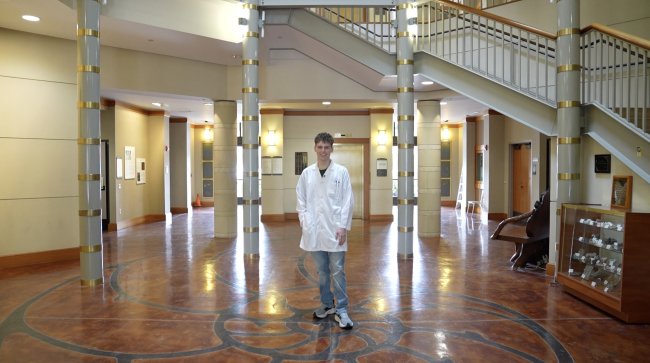 Aidan Ellis posing lab coat