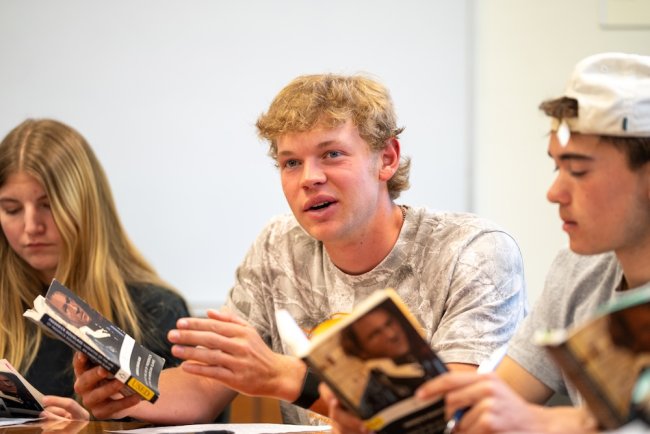 Three students at table in Collegiate Seminar