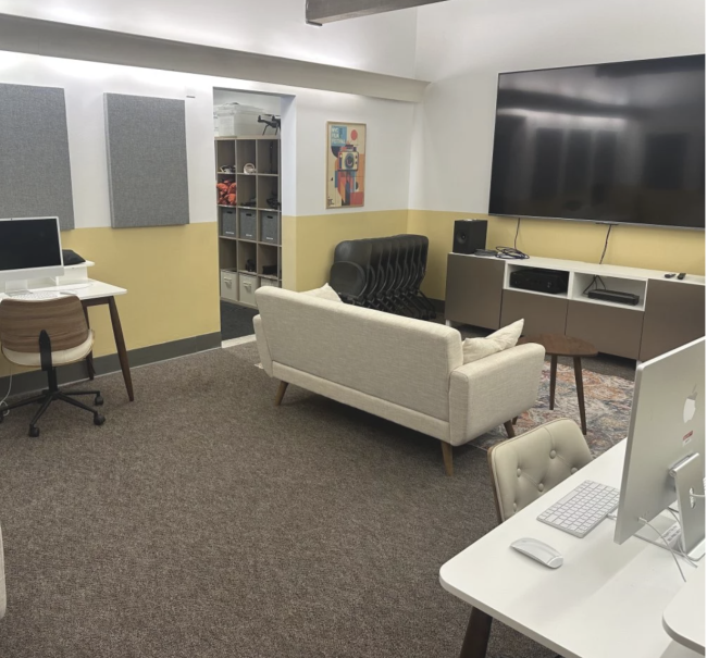 The lounge of the media center with two desks and a couch