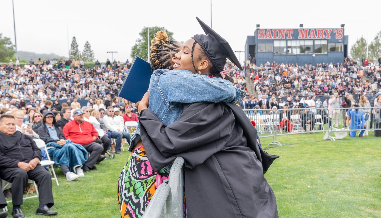 Grads hugging