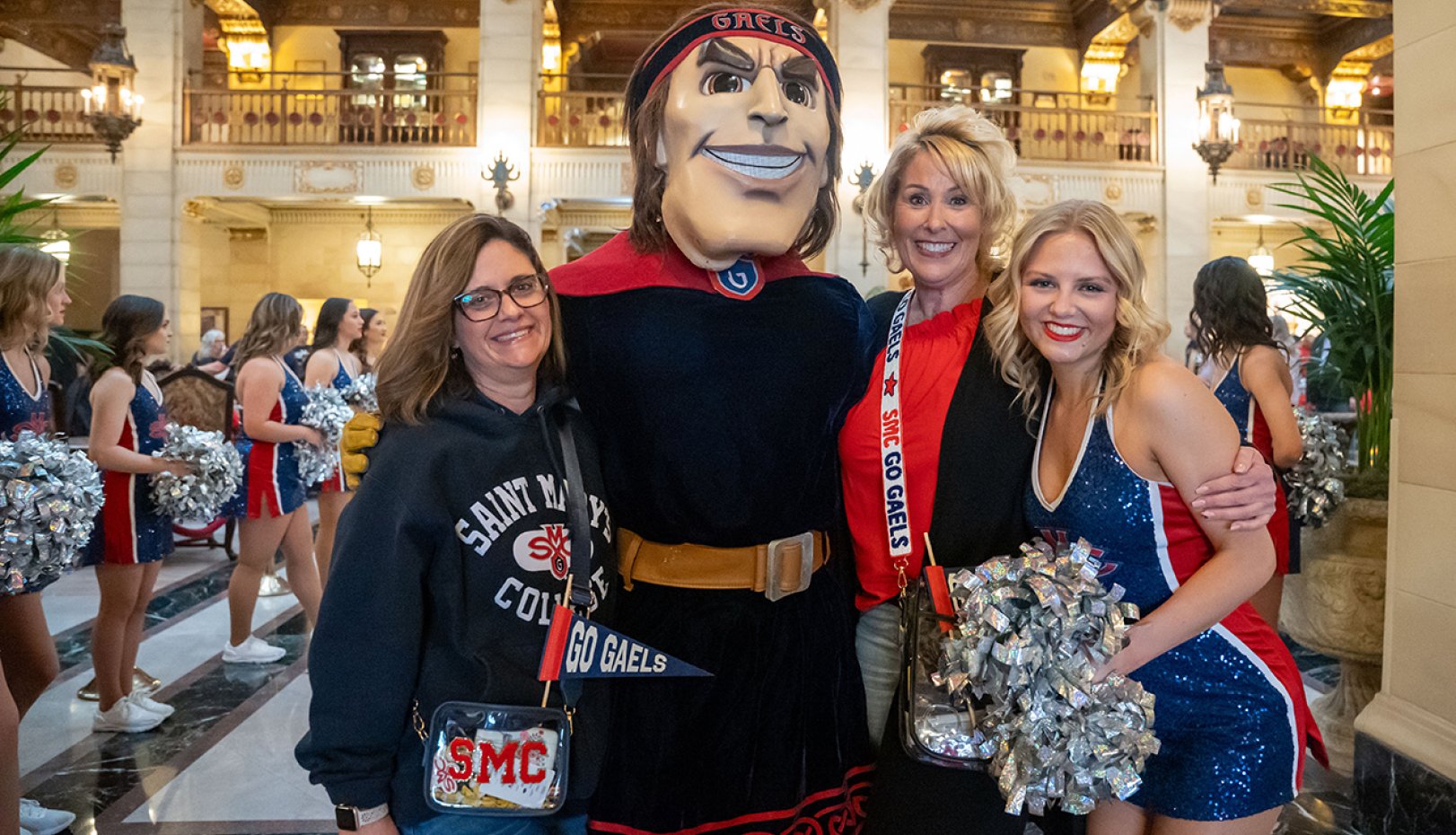 Two fans, spirit team member, and mascot Gideon at 2024 NCAA Tournament Pregame Party