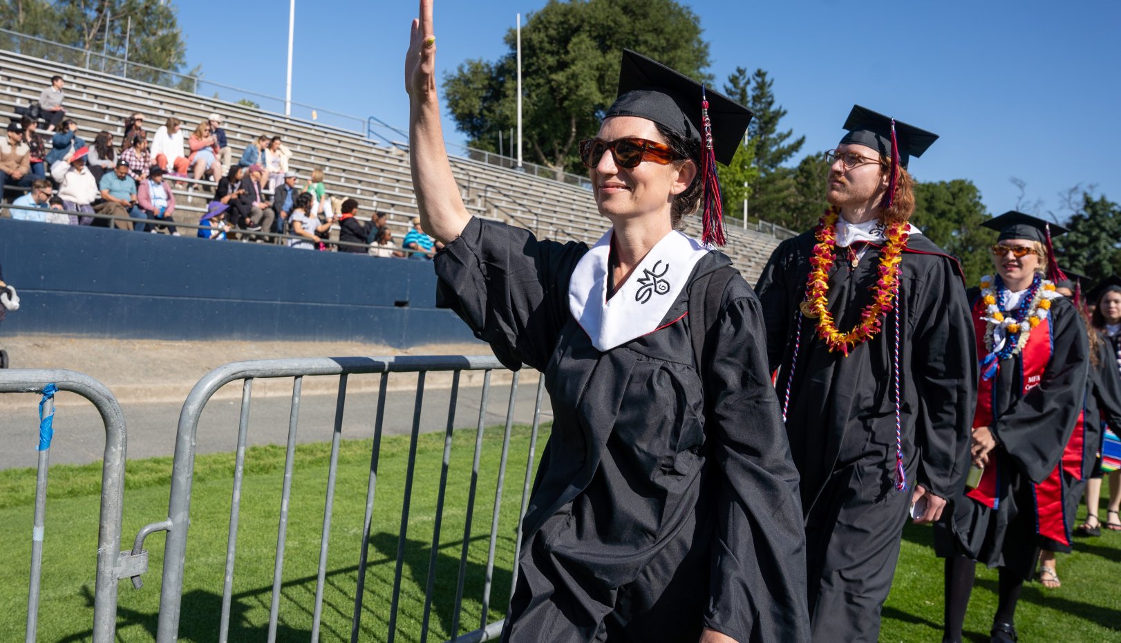Waving student