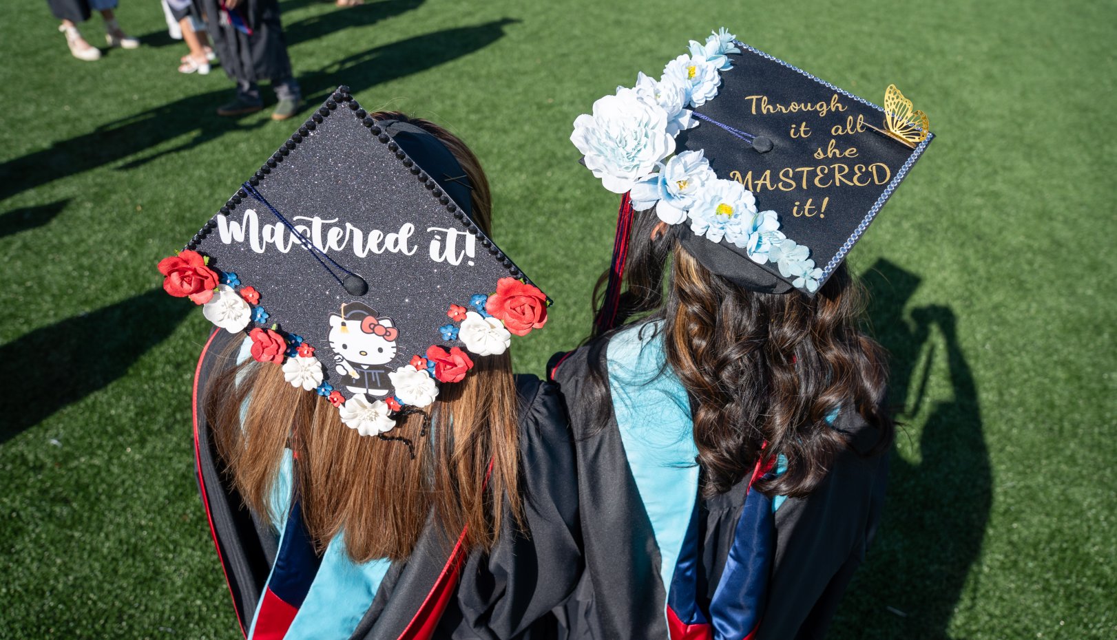 Showing their mortarboards