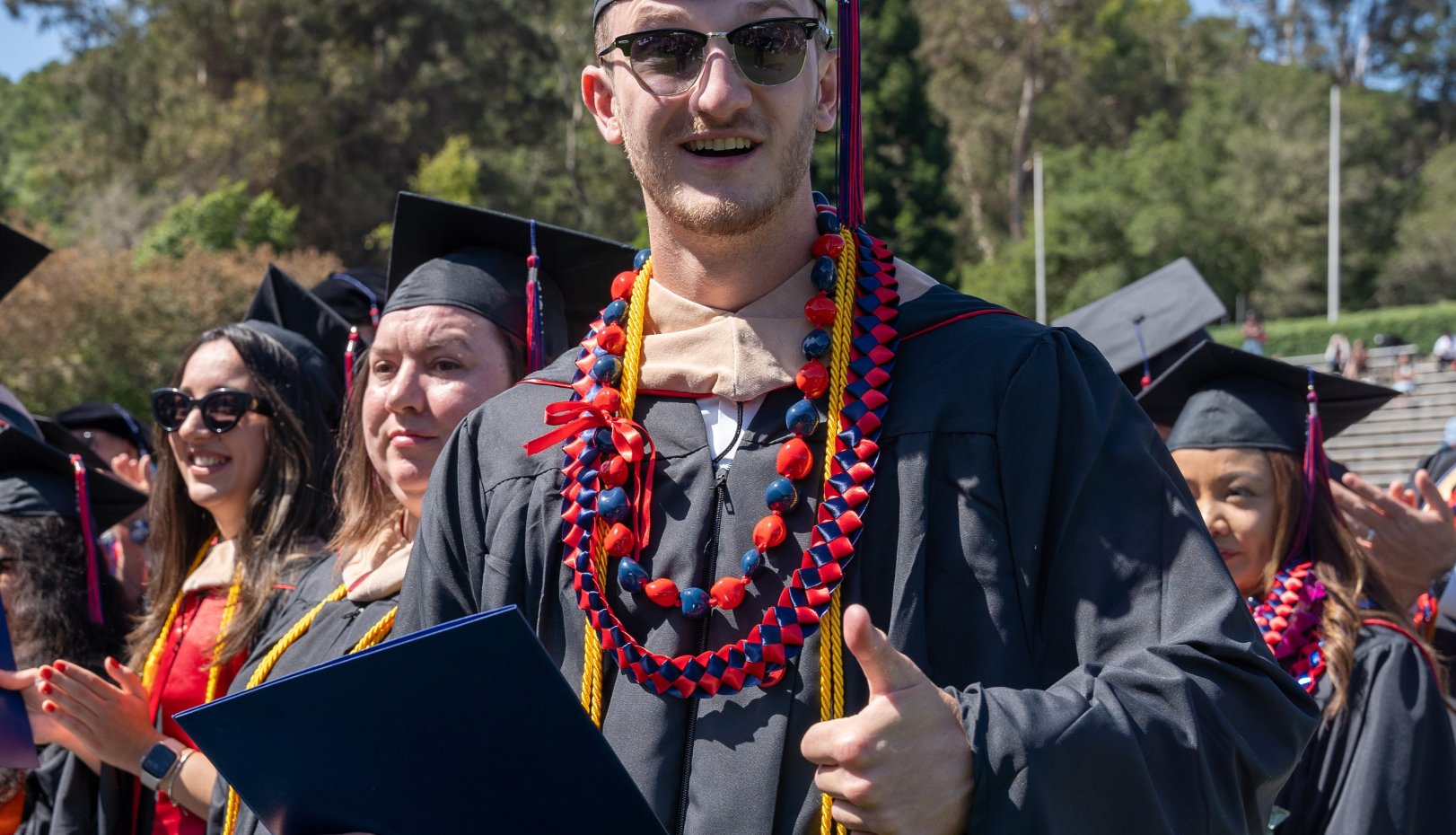 Thumbs up grad