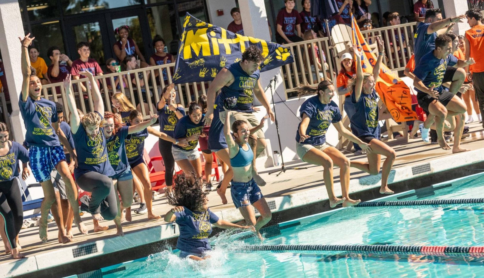 students from Mitty Hall jump in pool in 2024 first year olympics