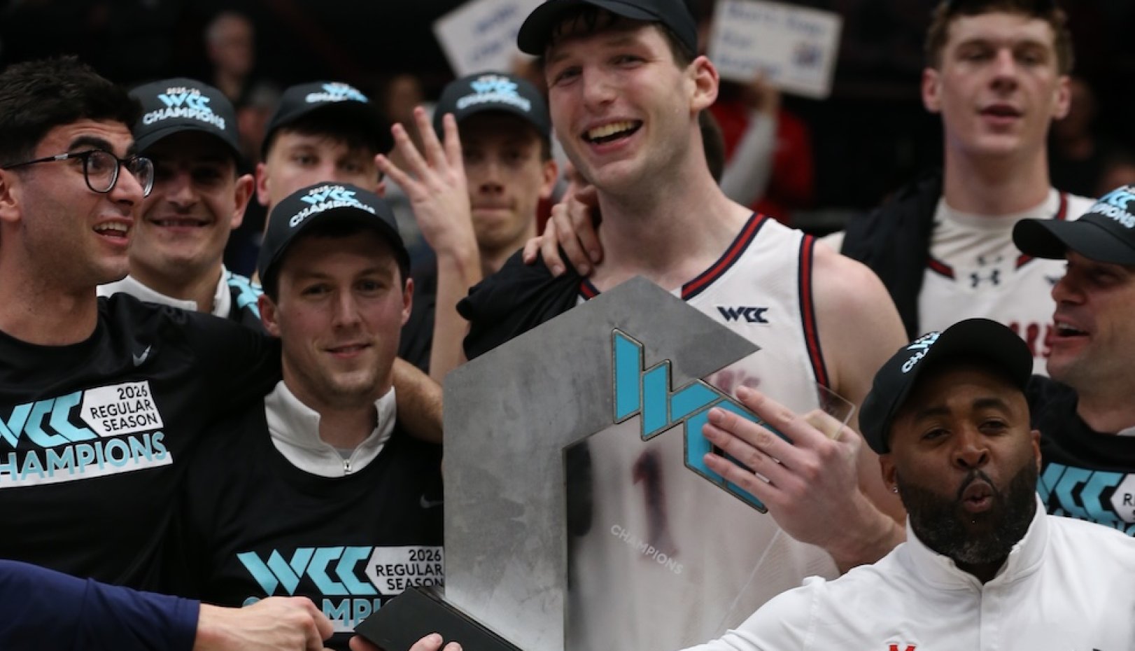 Men's Basketball players celebrate winning WCC Championship in February 2026