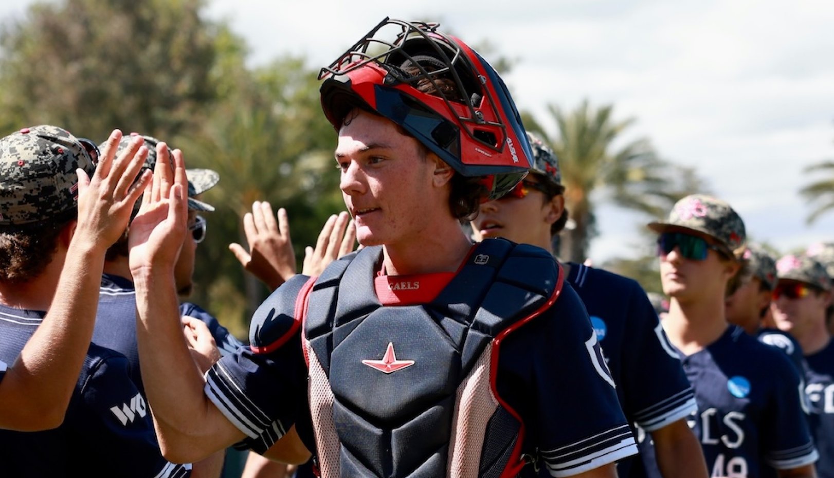 Catcher Ian Armstrong and Gaels high-five at 2026 NCAA Baseball Regional