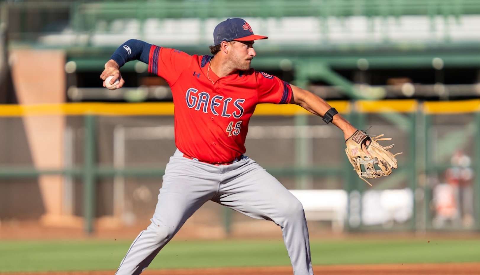 Baseball player Jared Mettam throws the ball as Gaels play USF in 2026 WCC Championship