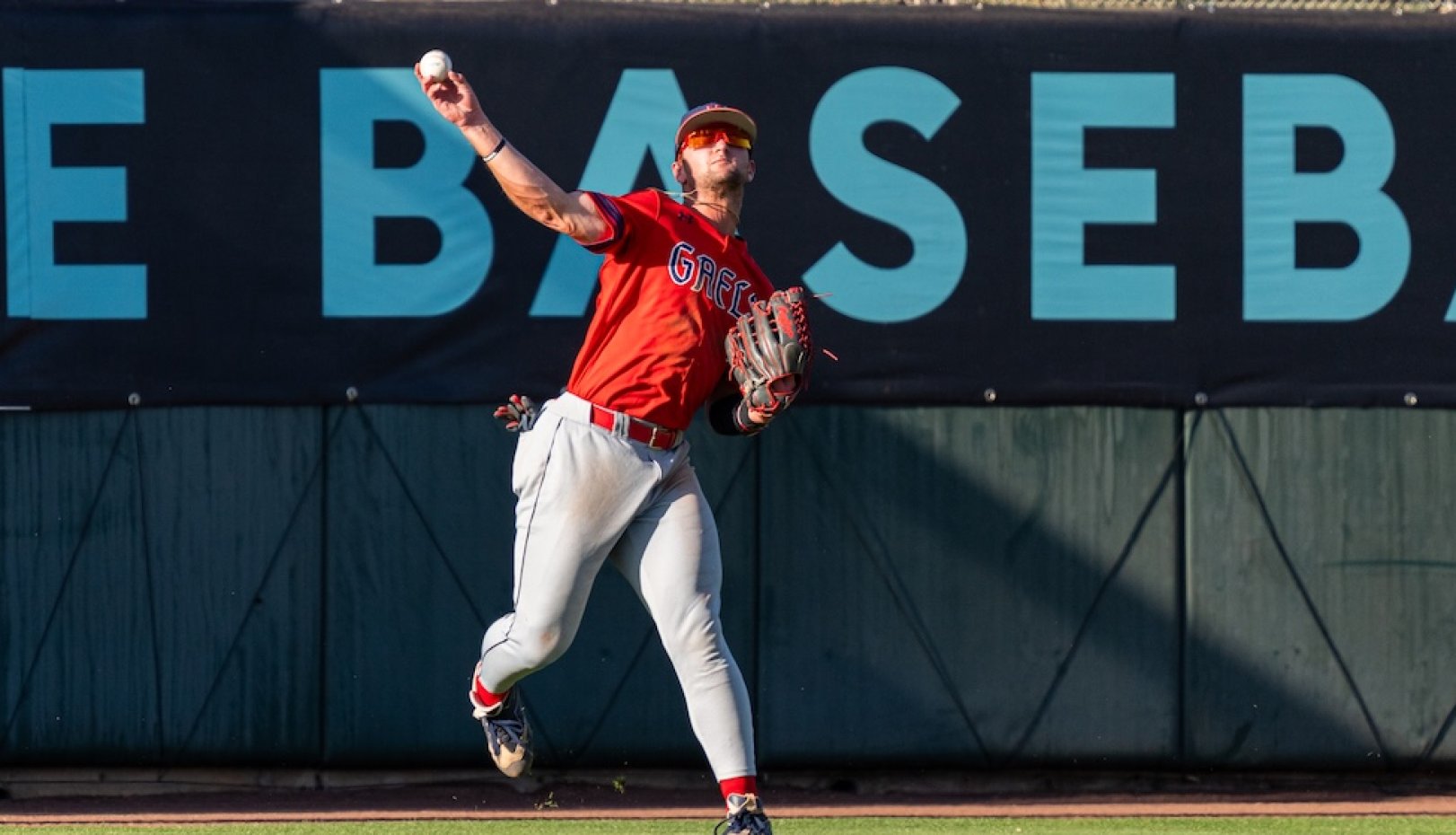 Outfielder throws the ball as Gaels play against USF in 2026 WCC Championship
