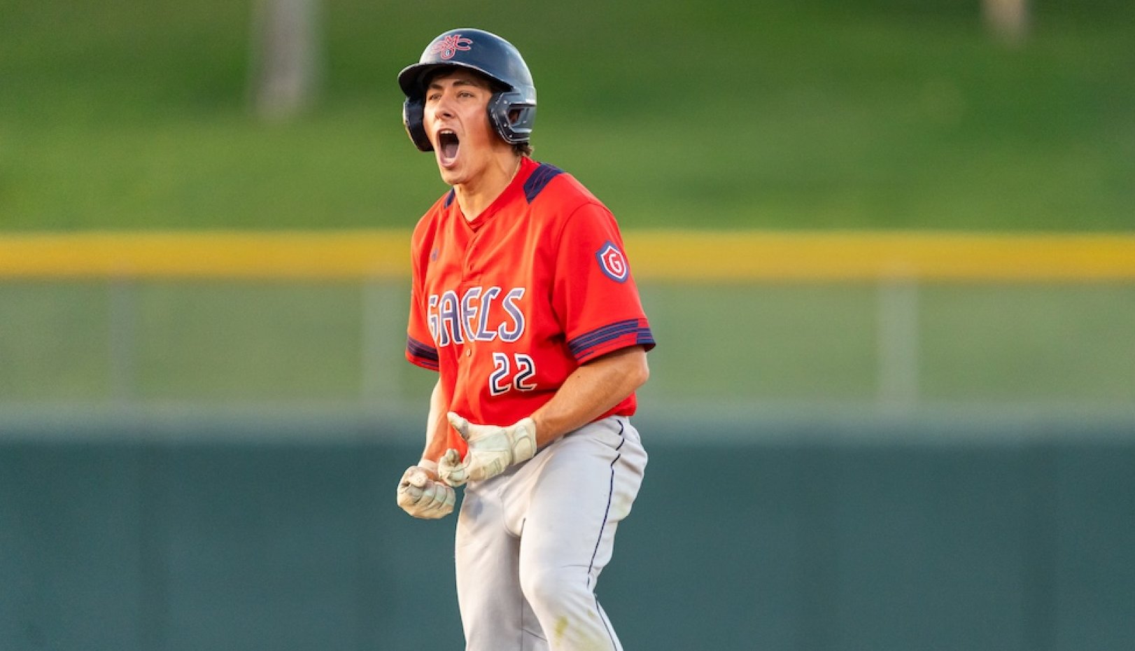 Baseball player Tyler Griffith cheers on base as Gaels play against USF in 2026 WCC Championship