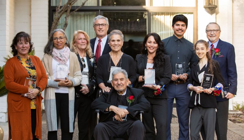 2023 Alumni Awards recipients, smiling and holding awards