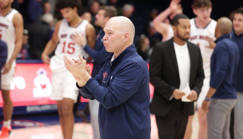 Randy Bennett claps during pregame introductions