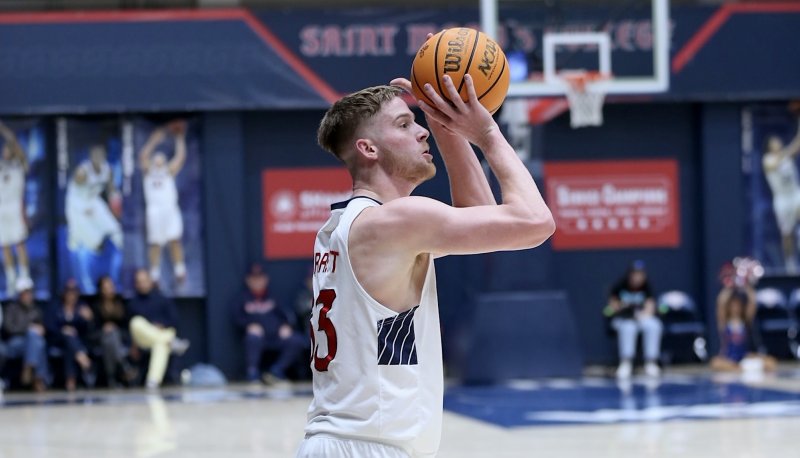 Men's basketball player Luke Barrett shoots against Cal Poly in November 2024
