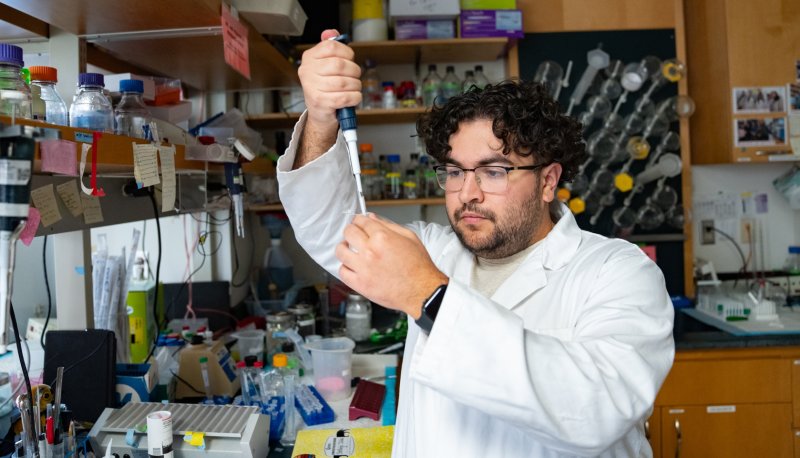 Sharbel AbouBechera '25 pipetting in a Saint Mary's lab
