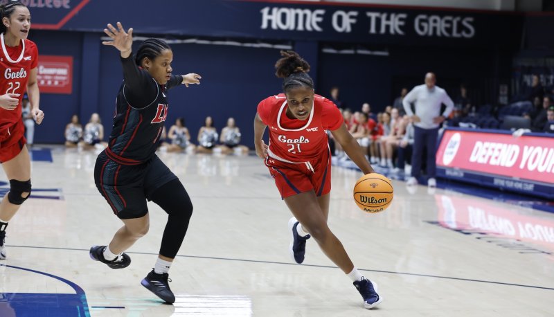 SMC Women's Basketball player Kennedy Johnson drives against LMU in January 2025