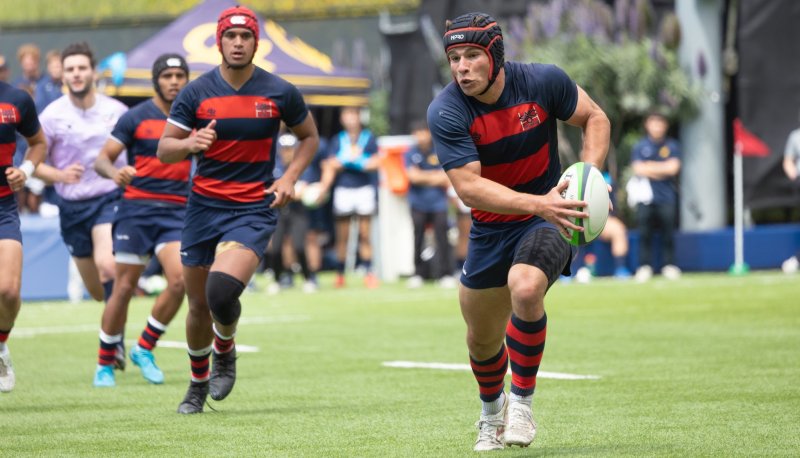 Rugby player Dom Besag '26 carries ball against Cal in semifinals in April 2025