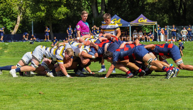 Men's rugby student-athletes from both Saint Mary's and UC Berkeley engage in a rugby scrum.