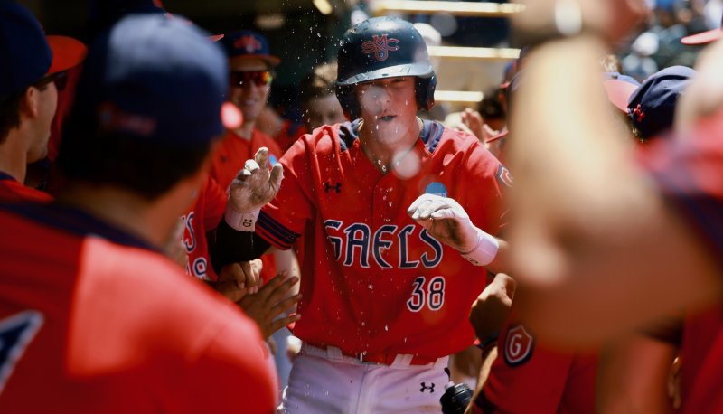 Baseball player Ian Armstrong cheers in dugout as Gaels defeat UCLA on May 31, 2026