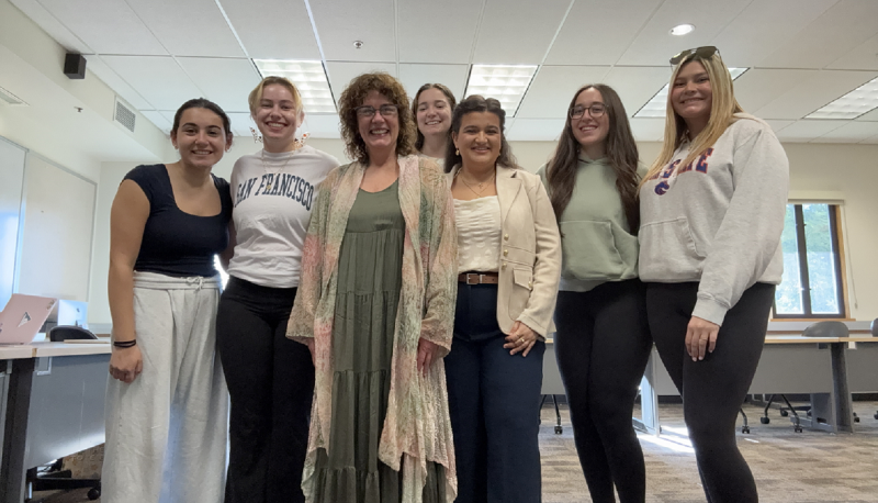 six Dante club students standing with Italian Professor De Angelis