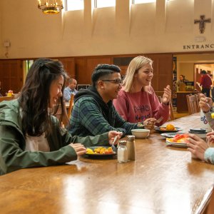 Students laugh over lunch