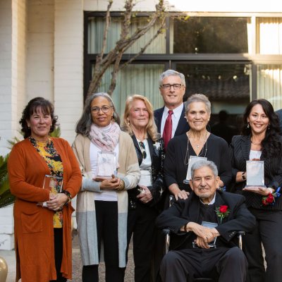 2023 Alumni Awards recipients, smiling and holding awards